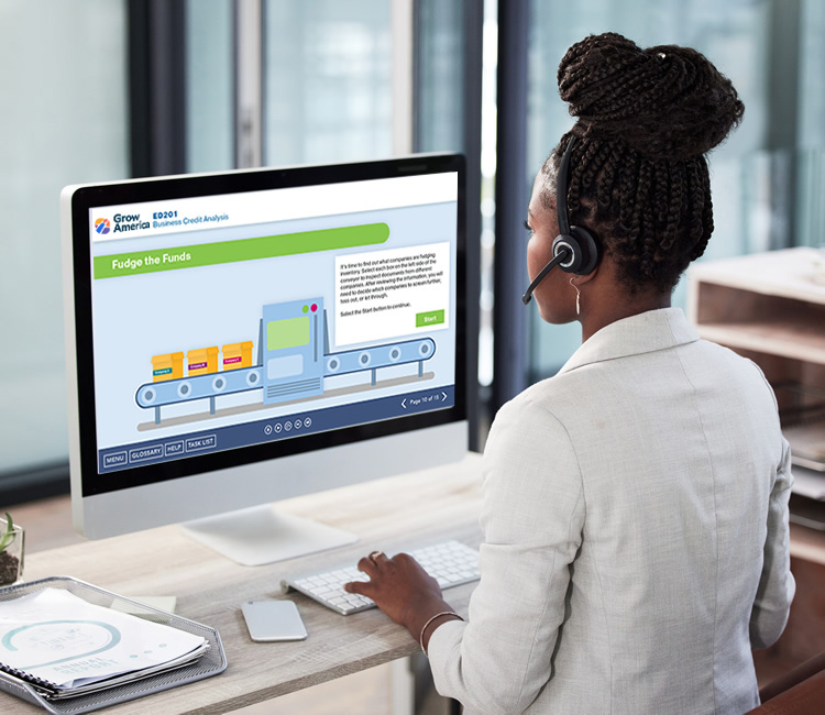 woman viewing an elearning module at desktop computer