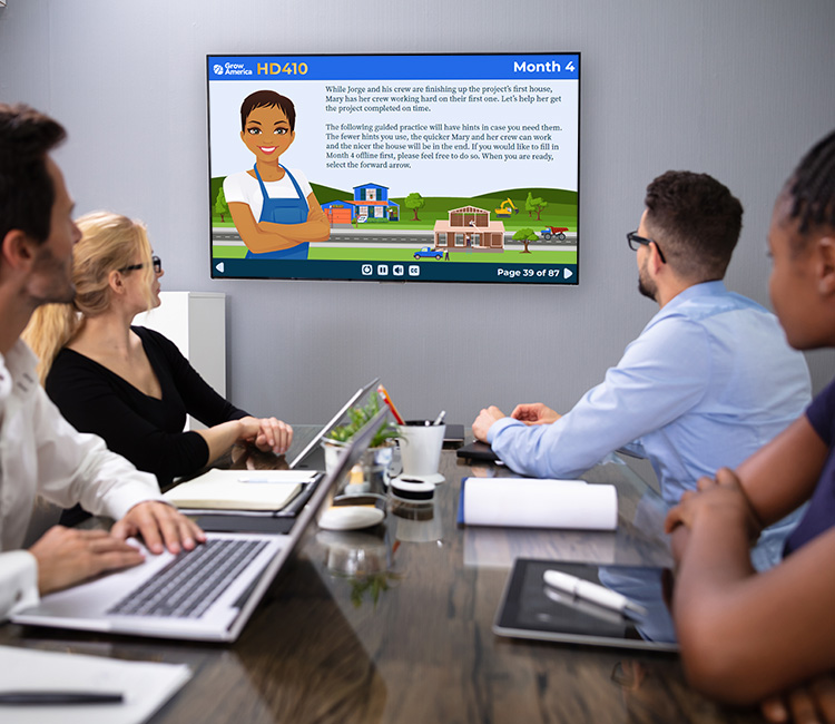 person at a desk viewing an elearning module on a tablet